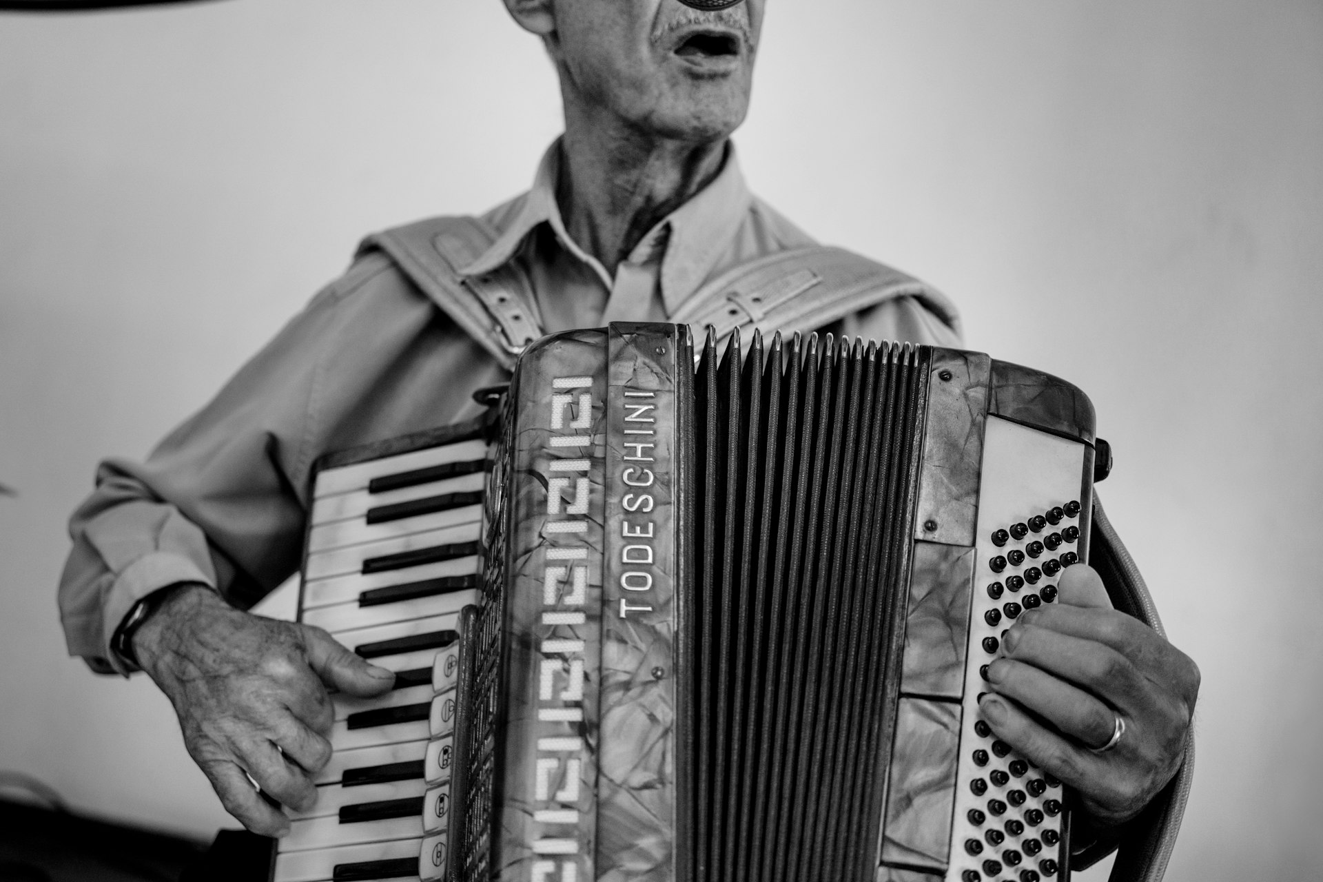a man holding an accordion in his hands